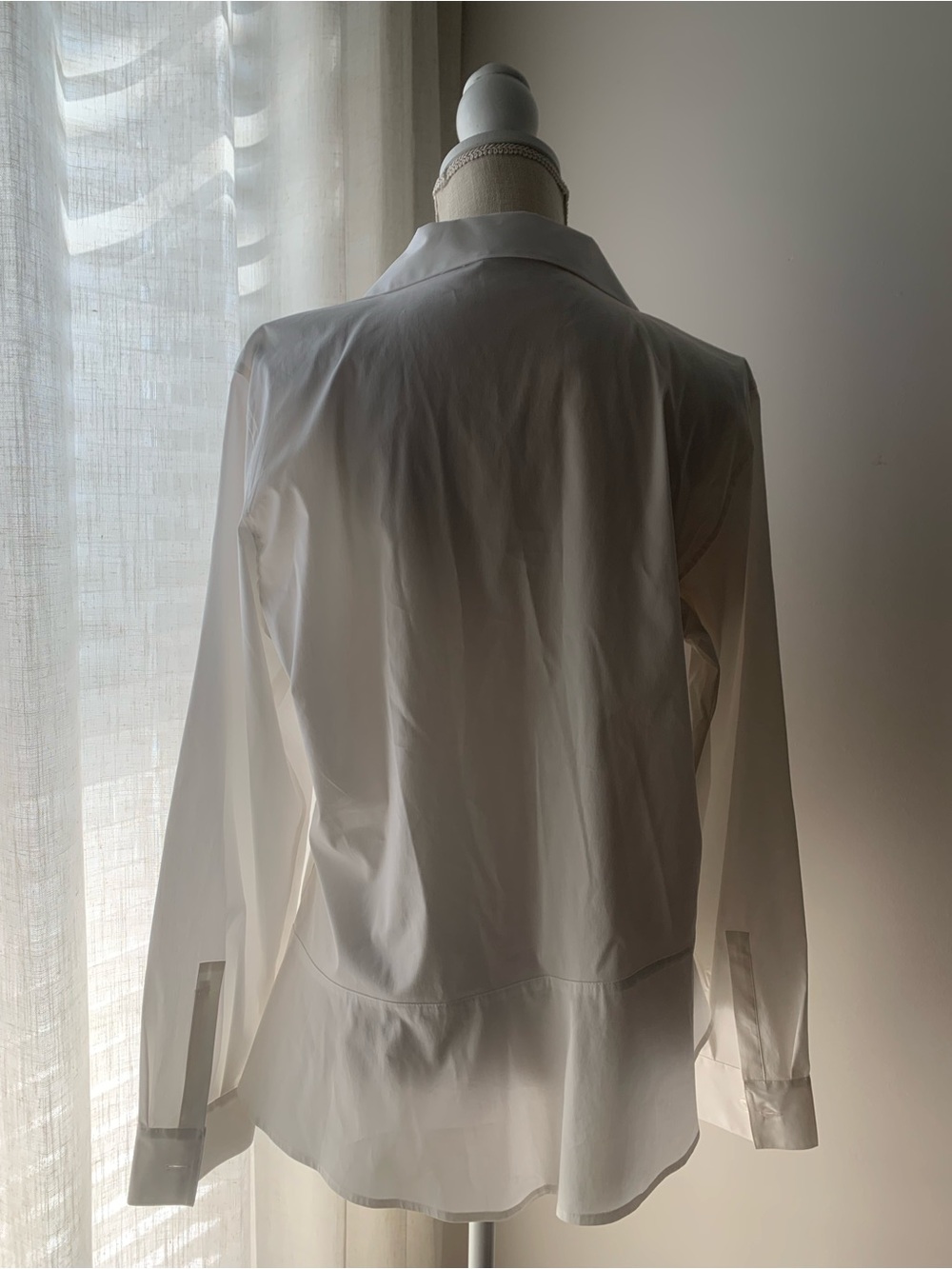 Classic White Button-Front Peplum Blouse with Asymmetrical Design - Picture 2 of 7